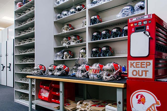 Work Bench and 4-Post Shelving in Football Helmet Maintenance Area