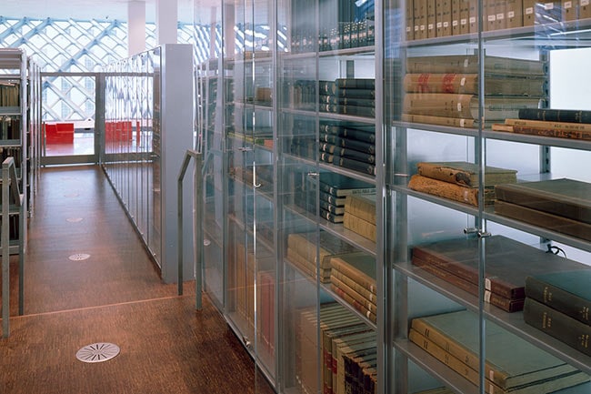 Special Collections Stored on 4-Post Shelving with Plexiglass Cabinet Enclosure