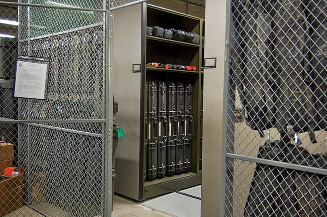 Powered Compact Shelving in Military Weapons Cage