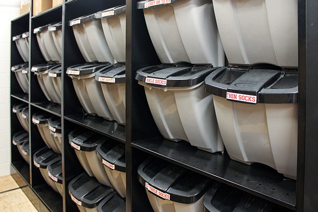 Tote storage for athletic equipment on 4-Post shelving